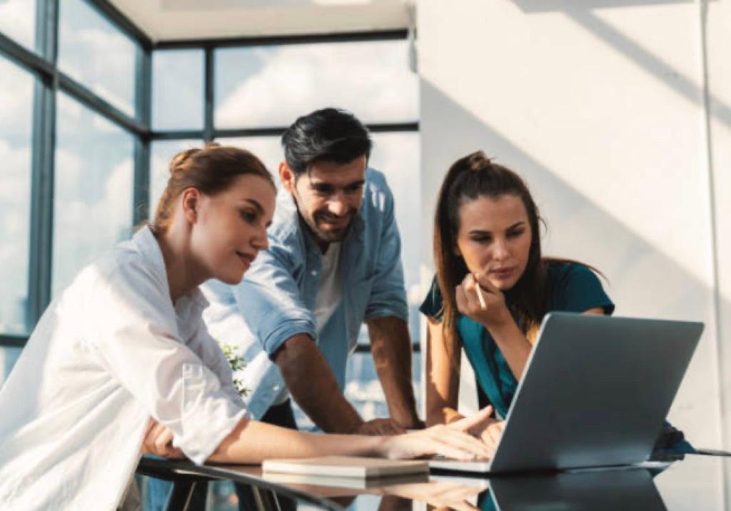 People reviewing a project on a computer