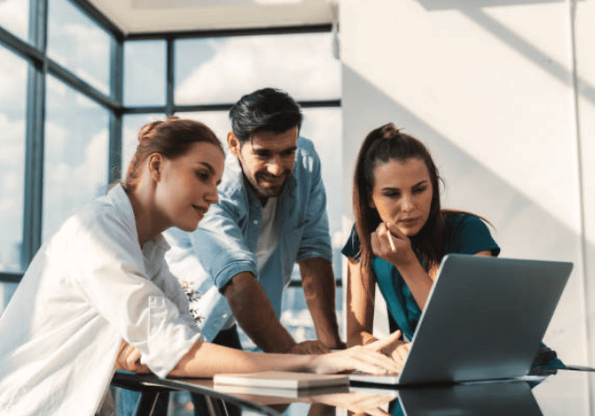 People reviewing a project on a computer