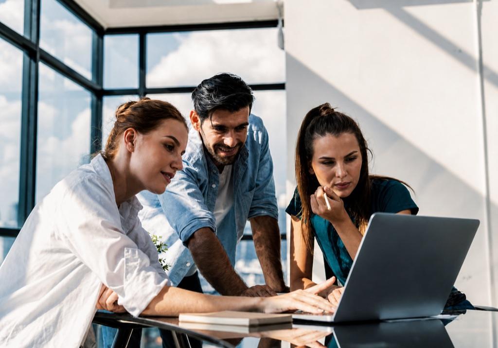 People reviewing a project on a computer